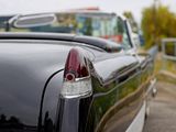 an image of a classic car parked on the side of the road