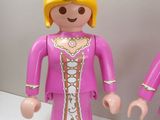 two toy figures that are standing next to each other