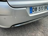 a silver car parked on the side of the road