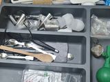 a tray that has various items in it on a table