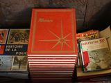 many books that are sitting in a box