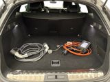 a trunk of a car with a bunch of wires in it