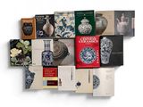 a lot of books that are stacked on top of each other