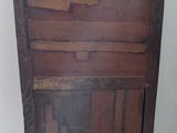 a wooden cabinet with a drawer on top of it
