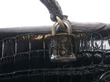 an image of a black purse with a padlock on it