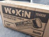 boxed box of wokin tape dispenser on grey cloth