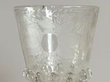 a glass cup that is sitting on a table