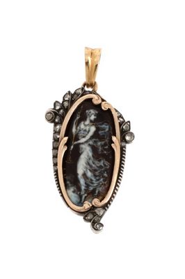 a black and gold pendant with a picture of a woman in a dress