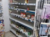 many shelves in the store that have canned food on them