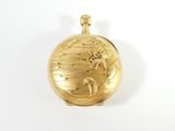 a gold locke with a picture of a woman on it