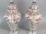 two vases that have been decorated with flowers and birds