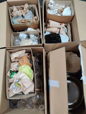 several boxes filled with assorted items sitting on top of a table