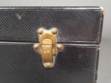 a small black box with a gold lock on it