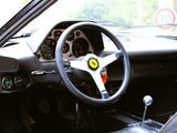 a steering wheel and dashboard of a car in a car showroom
