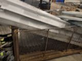 many pieces of metal on the floor in the warehouse