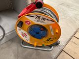 a hose that is connected to a reel on the ground