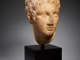 a roman marble head of a youth