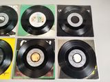 four black and white records sitting on top of a table