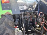 a tractor that is parked on the side of the road