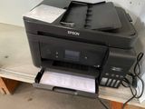 a printer that is sitting on top of a table