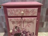 purple and white painted cabinet with flowers and butterflies on it