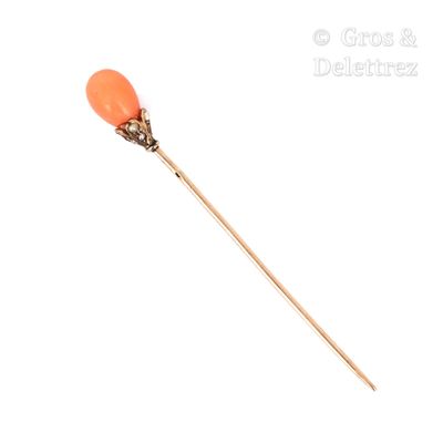 une image représentant un bâton surmonté d'une balle orange