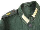 a close up of a military uniform with a badge on the collar