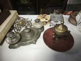 a lot of silver items sitting on a table