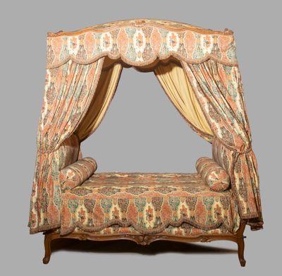 a bed that has a canopy over it