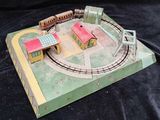 a model of a train set on a black surface