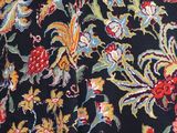 a close up of a dress with a floral pattern on it