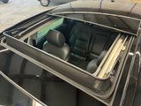 a car that has a window open in the back of it
