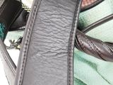 a close up of a purse with a handle on it