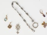 several pieces of jewelry including a chain, a ring, and a pair of earrings