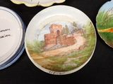 three plates that are sitting on a black table