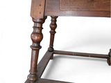 a small wooden table with a drawer on it