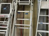 many ladders that are sitting next to each other