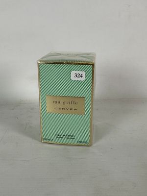 an image of a small box of perfume sitting on a table