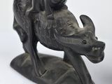 a statue of a rhino with a baby on it ' s back