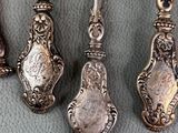 three spoons and a spoon rest on a blue cloth