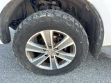 a close up view of a tire on a vehicle