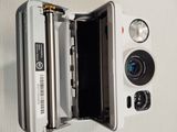 a white camera that is open on a table