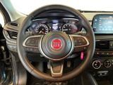 the interior of a car with a steering wheel and dashboard controls