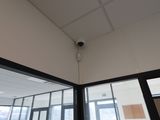 a camera mounted on the ceiling of a building
