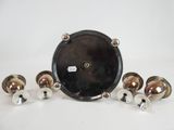 an image of a clock with five bells on a white surface