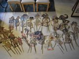 many different types of paper dolls on display on the floor