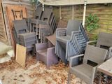 a lot of chairs and tables in the yard
