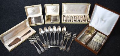 many different types of silverware in a case