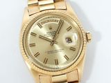 an image of a gold rolex watch with roman numerals on the dial