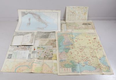 many maps on the table with a lot of them